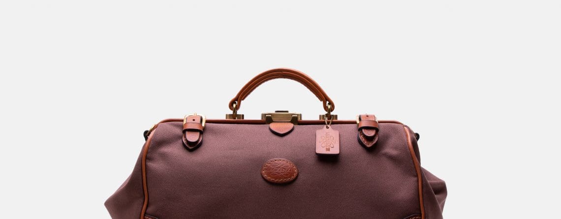 Waterproof travel bag in canvas & leather brown colour, handmade by Mackenzie Leather Edinburgh.